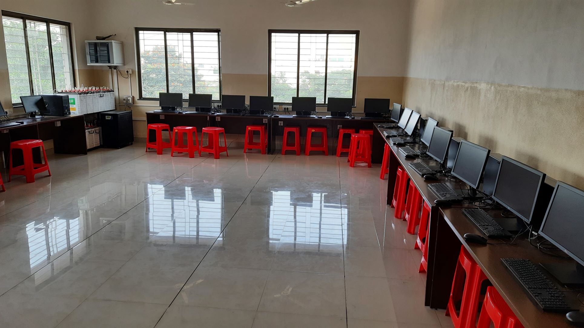 A modern computer lab with students working on computers